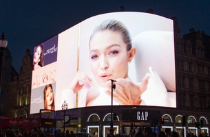 Gigi Hadid Debuts Maybelline Cosmetics Collection On Piccadilly Lights