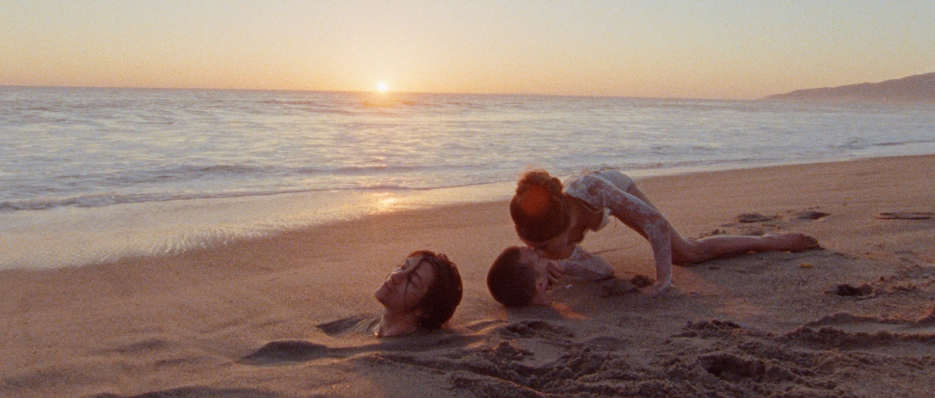 The Last Shadow Puppets Get Buried on a Beach in New Music Video