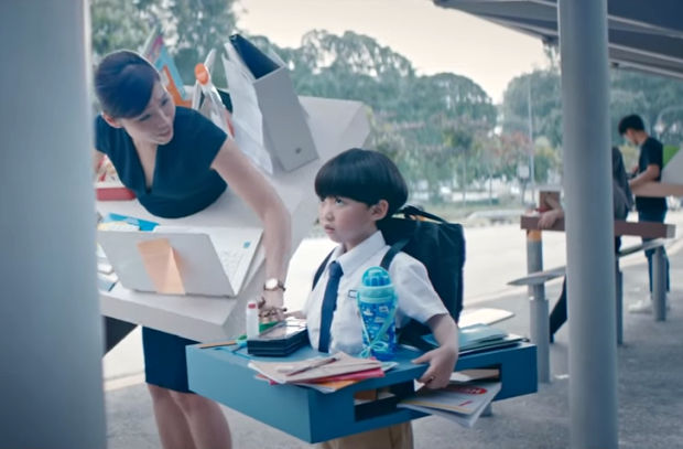 Deskbound Families Dramatise the Epidemic of 'Busyness' in Compelling Campaign